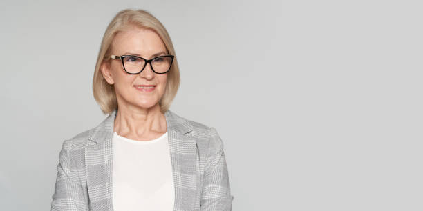 istock elderly businesswoman is smiling 1285603691