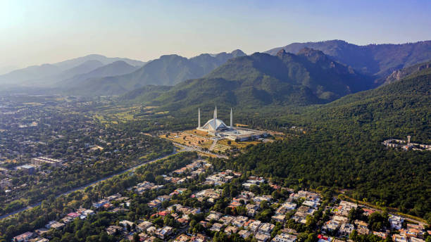 Shah Faisal mosque is the masjid in Islamabad, Pakistan. Located on the foothills of Margalla Hills. The largest mosque design of Islamic architecture, Mosque Drone Footage stock photo
