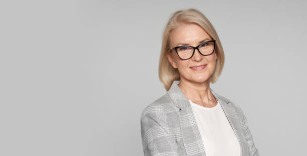 istock elderly businesswoman is smiling 1285603787