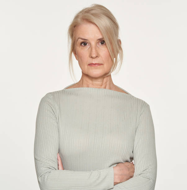 istock Blonde senior woman isolated on white background 1285603938