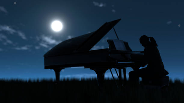 istock Pianist playing piano outside on grass field under moonlight 3d rendering 1285604787