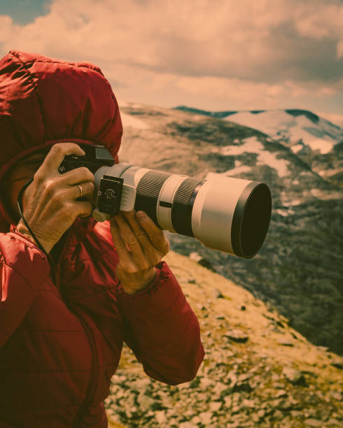 istock Tourist taking photo fin norwegian mountains 1285606140
