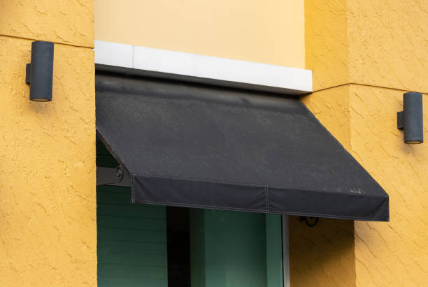 istock black awning over store window. dirty black canvas roof. 1285607350