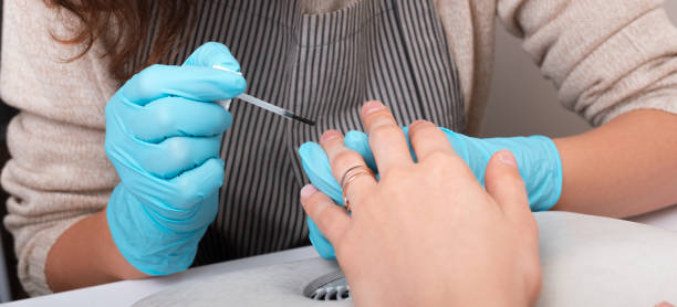 istock A young woman is at salon doing her nails 1285607718