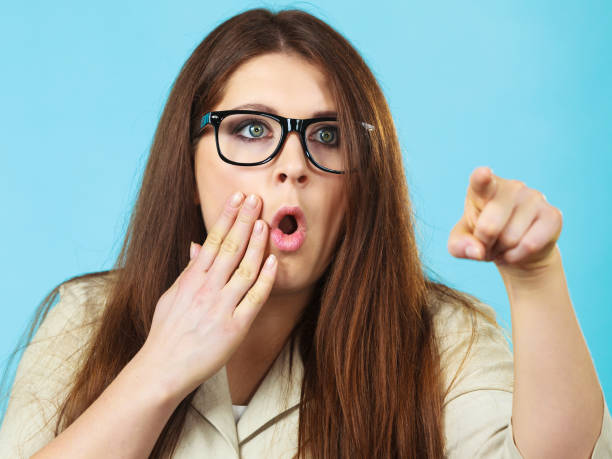 istock Shocked and surprised woman pointing 1285608325