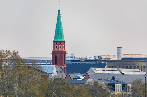 Far view on the green spire of the Nikolaikirche in Frankfurt
