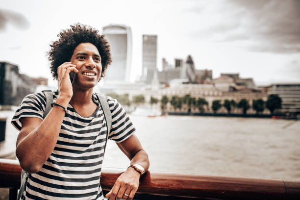 istock man on the phone in the city 1285608921