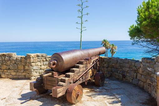 The old cannon named Marabutto against the sea in Bordighera, Italy