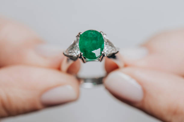 Beautiful Ring with Green Emerald and Gold Metal - 3D Illustration Render