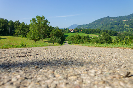 Low angle view on an asphalt road against mountains