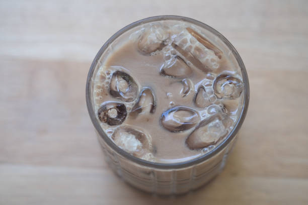 Close up of iced coffee on wooden table.