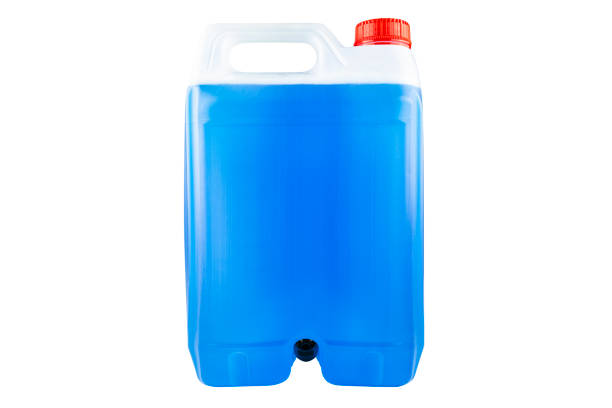 istock Winter blue windshield washer fluid in a five liter bottle, closed with a red cap and with a funnel at the bottom, isolated on a white background with a clipping path. 1285621043