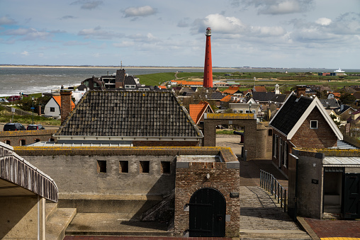 View on Huisduinen, lighthouse Lange Jaap and sea from the leaden roof of fortress Kijkduin