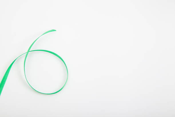istock Curved green wavy ribbon on white 1285622198