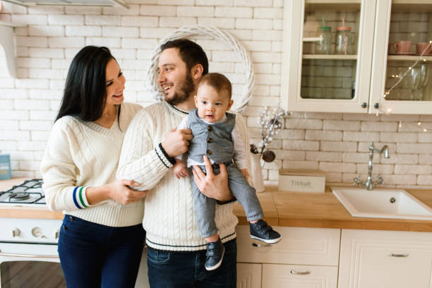 istock Happy family in the kitchen at home 1285628021
