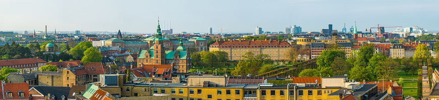 Aerial panoramic view over the rooftops and historic spires of Copenhagen, Denmark’s vibrant capital city.