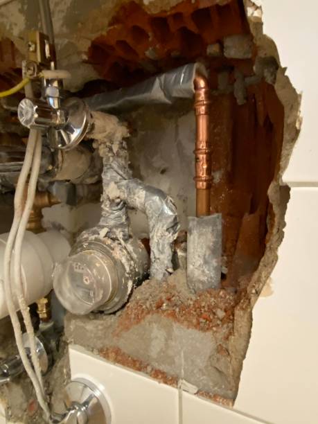 istock Water pipes exposed in brick wall 1285632516