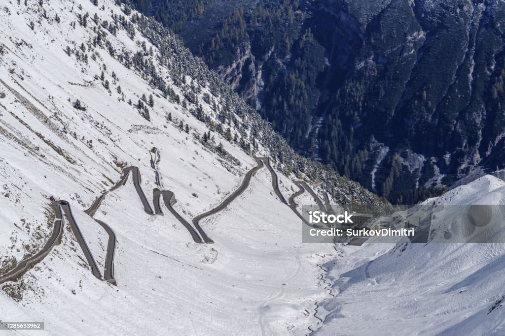 Part of the Stelvio pass road, South Tyrol, Italy Winding road towards Stelvio Pass in the snowy landscape, high angle view, South Tyrol, Italy Snow Stock Photo