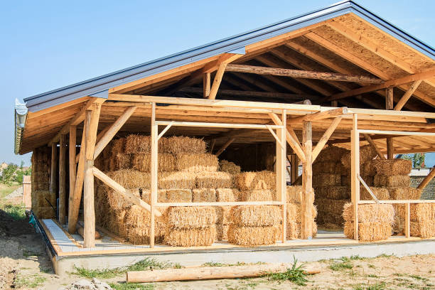 istock Straw bale house construction with a roof 1285635054