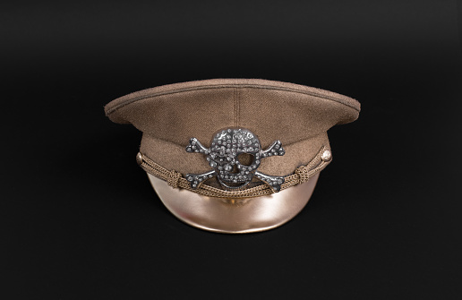 cap dictator, military gold cap isolated on black background