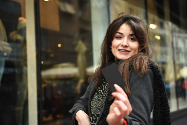 istock Young beautiful woman in shopping 1285642107