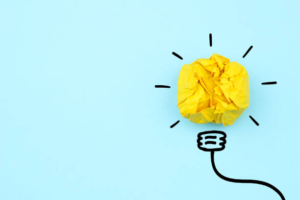 istock Creative idea, Inspiration, New idea and Innovation concept with Crumpled Paper light bulb on white background 1285642310