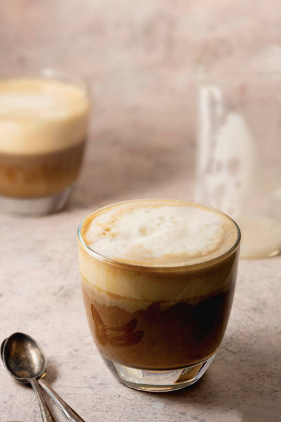 istock Two glasses of coffee drink with whipped milk, latte hot drink 1285643570