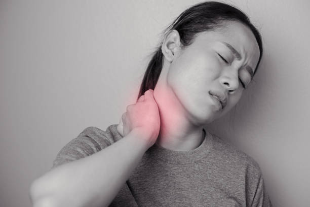 istock Woman with pain in neck. 1285647141