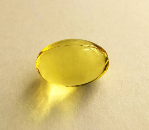 istock Fish oil capsule Omega 3 on a white background 1285647608