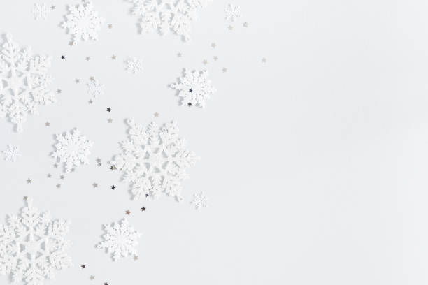 istock Christmas composition. Christmas frame made of snowflakes on pastel gray background. Winter concept. Flat lay, top view 1285648919