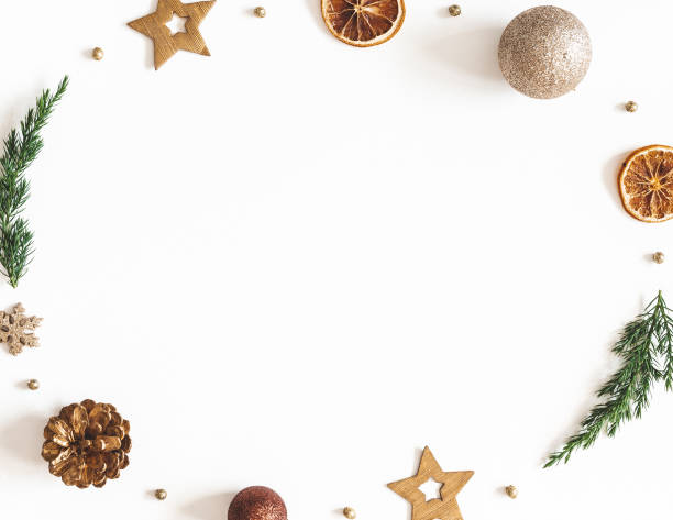istock Christmas composition. Wreath made of fir tree branches, golden decorations on white background. Christmas, winter, new year concept. Flat lay, top view 1285648938