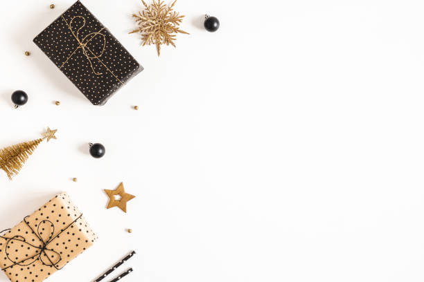 istock Christmas composition. Gift boxes, black and golden decorations on white background. Christmas, winter, new year concept. Flat lay, top view, copy space 1285648989