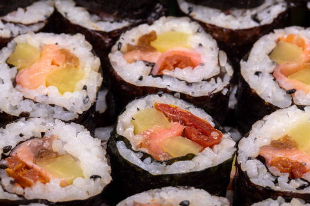 istock Top view of stack of Japanese sushi maki roll plate. 1285652835