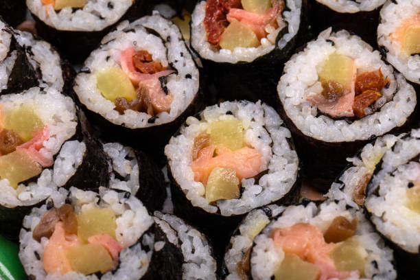 istock Top view of stack of Japanese sushi maki roll plate. 1285653357