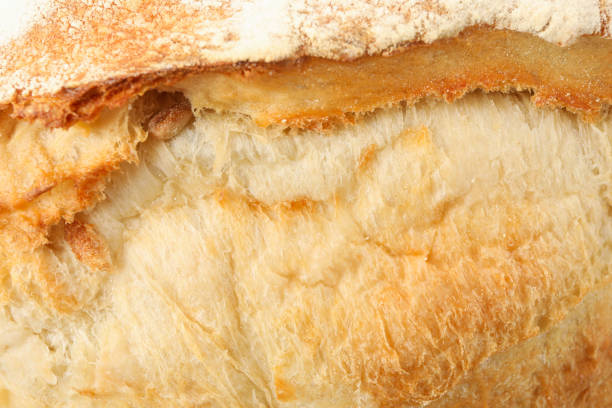 istock Fresh baked bread on whole background, close up 1285655257