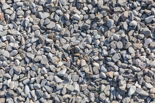 The texture of fine gravel scattered on the ground