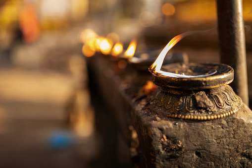 Chinese people worship their Gods with incenses, candles, oil lamps, and food at the temples.
