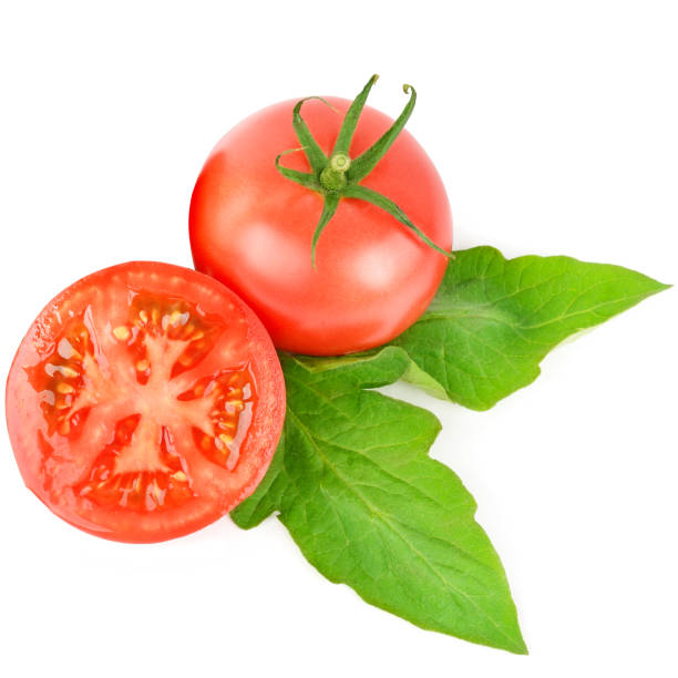 istock Whole and cut fresh, red tomatoes with green steam isolated on white background. 1285658723