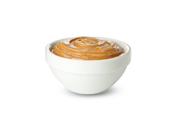 istock Bowl with peanut butter isolated on white background 1285658726