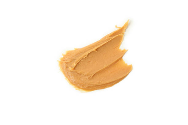istock Tasty peanut butter isolated on white background 1285658812