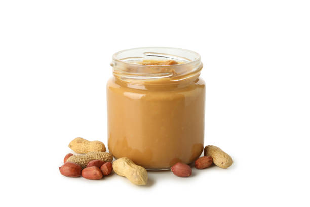 istock Jar with peanut butter and peanut isolated on white background 1285658968