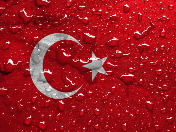 istock flag of Turkey with rain drops 1285660158