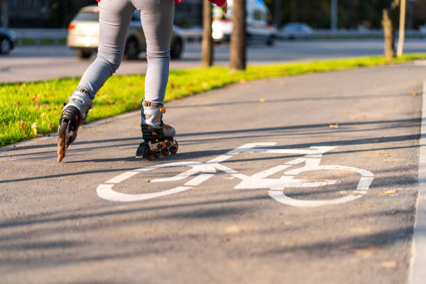 istock Active leisure. A sportive girl is rollerblading in an autumn park 1285664037