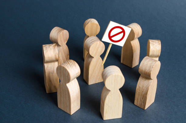 istock People surround a man with a poster. Agitation, drawing public attention to the problem. Single picket, fight against corruption and arbitrariness. Populism and nationalism. Strike fight for rights 1285664202