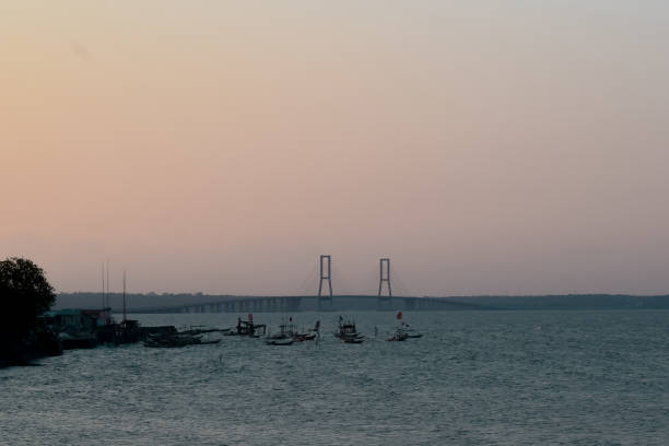 istock Sunset view between the sea, the bridge, and the ship 1285664266