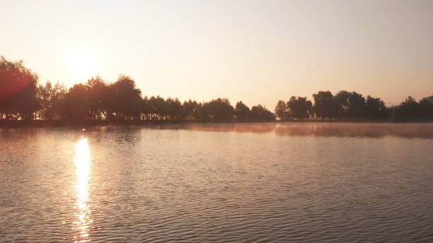 istock Sun glare on the surface of water. 1285665520