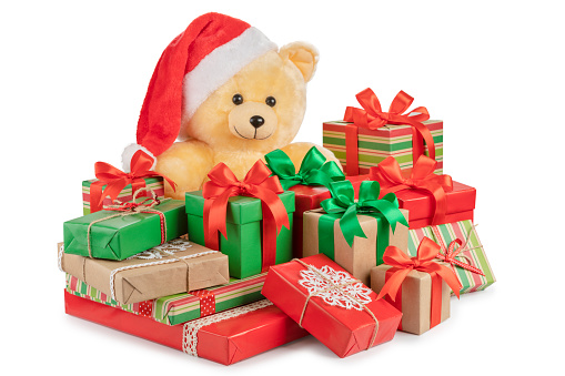 Teddy bear and boxes with gifts isolated on white.