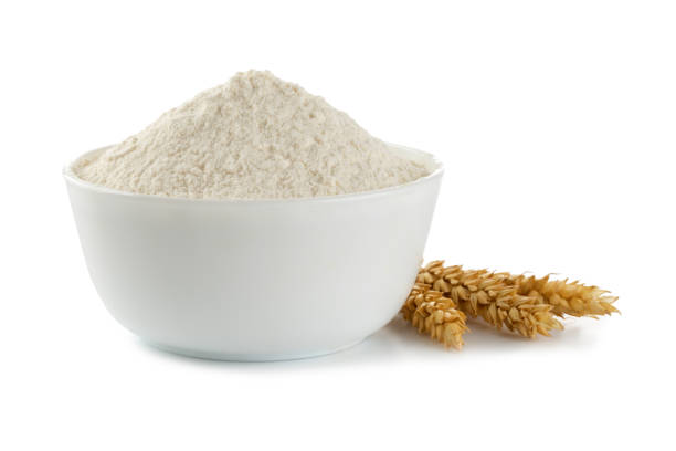 istock Bowl with flour on white background. spikelets of wheat 1285665677