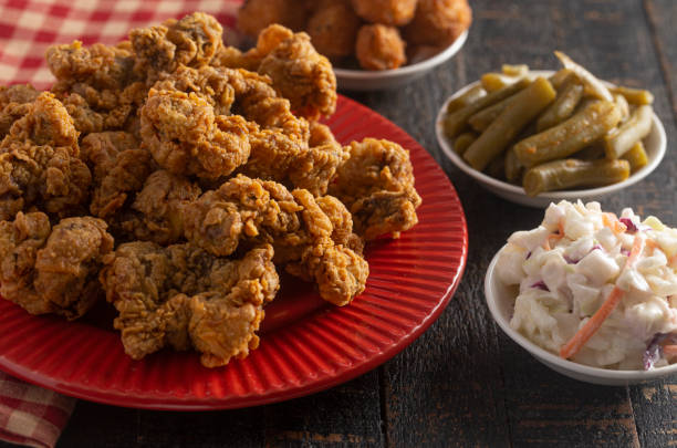 istock Fried and Crispy Chicken Gizzards on a Rustic Wooden Table 1285667057