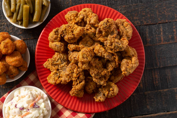 istock Fried and Crispy Chicken Gizzards on a Rustic Wooden Table 1285667964
